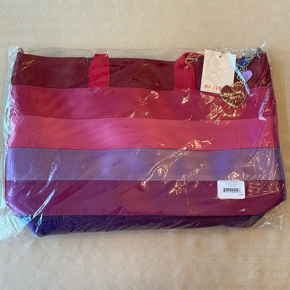 Harvey’s medium streamline tote in Purple Love. Brand new with tags and charms